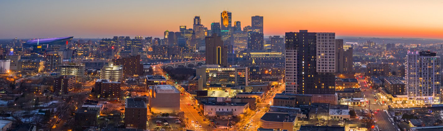 A panoramic photograph of the Minneapolis skyline taken at sunset. Photo by Lane Pelovsky, courtesy of Meet Minneapolis